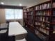 Quiet library with a long table and extensive bookshelf at 3128 59Th S St # 209, Gulfport, FL 33707