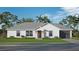 Single-story home with attached garage and landscaped yard at 0 Trapper John Rd, Weeki Wachee, FL 34614