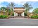 Community center entrance with inviting landscaping and stone accents at 15810 Cobble Mill Dr, Wimauma, FL 33598