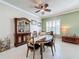 Spacious dining area with an oval table, wooden chairs, and built-in hutch at 15810 Cobble Mill Dr, Wimauma, FL 33598