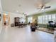 Open living space with dining area, office nook, and green accent wall at 15810 Cobble Mill Dr, Wimauma, FL 33598
