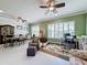 Bright dining room features a spacious layout, large windows, and elegant furnishings at 15810 Cobble Mill Dr, Wimauma, FL 33598