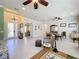 Open living room with high ceilings and tile flooring, flows into the dining area at 15810 Cobble Mill Dr, Wimauma, FL 33598