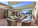 Relaxing outdoor patio with wicker furniture and water features at 15810 Cobble Mill Dr, Wimauma, FL 33598