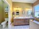 Modern bathroom with double vanity, separate toilet area, and large shower at 15810 Cobble Mill Dr, Wimauma, FL 33598