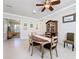 Charming dining room with an oval table, wooden chairs, and built-in hutch at 15810 Cobble Mill Dr, Wimauma, FL 33598