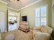 Guest room with view into adjacent room, TV, and comfortable seating at 15810 Cobble Mill Dr, Wimauma, FL 33598
