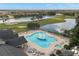 Resort-style pool with fountains and surrounding lounge area at 29624 Tee Shot Dr, San Antonio, FL 33576