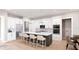 Modern kitchen with white cabinets, island, and stainless steel appliances at 0 Dusky Warbler Rd, Weeki Wachee, FL 34614