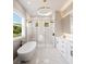Elegant bathroom with soaking tub, glass shower, and marble flooring at 0 Dusky Warbler Rd, Weeki Wachee, FL 34614