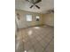 Large living room with tile floors and ceiling fan at 411 S Orleans Ave, Tampa, FL 33606