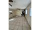 Spacious living area with tile floors and hallway at 411 S Orleans Ave, Tampa, FL 33606