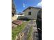 Backyard with concrete patio and AC unit at 411 S Orleans Ave, Tampa, FL 33606
