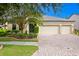 Beautiful two-story house with a three-car garage and manicured landscaping at 3320 Majestic View Dr, Lutz, FL 33558
