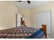 Bedroom with a queen-size bed, a door to the hallway, and a large closet at 3320 Majestic View Dr, Lutz, FL 33558