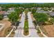 Gated community entrance with a tree-lined road at 3320 Majestic View Dr, Lutz, FL 33558
