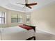 Bright bedroom featuring a ceiling fan and ample natural light at 3320 Majestic View Dr, Lutz, FL 33558