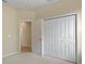 Bedroom with an adjacent hallway and spacious closet at 3320 Majestic View Dr, Lutz, FL 33558