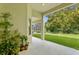 Covered patio with lush plants and a view of the backyard at 3320 Majestic View Dr, Lutz, FL 33558