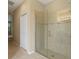 Modern bathroom with a large walk-in shower and glass enclosure at 3320 Majestic View Dr, Lutz, FL 33558