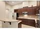 Kitchen features stainless steel appliances and granite countertops at 3320 Majestic View Dr, Lutz, FL 33558