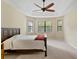 Spacious bedroom with large windows and ceiling fan at 3320 Majestic View Dr, Lutz, FL 33558