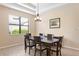 Dining room with a dark wood table and six chairs at 3320 Majestic View Dr, Lutz, FL 33558