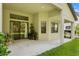 Covered patio with sliding glass doors leading to the backyard at 3320 Majestic View Dr, Lutz, FL 33558