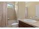 Clean bathroom with a shower/tub combo, a vanity with a sink, and a mirror at 3320 Majestic View Dr, Lutz, FL 33558