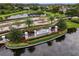 Stonebriar community entrance with a lake and lush landscaping at 3320 Majestic View Dr, Lutz, FL 33558