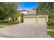 Two-story house with a two-car garage and manicured landscaping at 3320 Majestic View Dr, Lutz, FL 33558