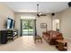 Spacious living room with large TV and access to patio at 3320 Majestic View Dr, Lutz, FL 33558