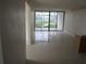 Bright living room with tile floors and sliding glass doors at 2424 W Tampa Bay Blvd # 208, Tampa, FL 33607