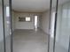 Spacious living room with tile floors and sliding glass doors at 2424 W Tampa Bay Blvd # 208, Tampa, FL 33607