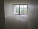 Living room with tile floors and access to a balcony at 2424 W Tampa Bay Blvd # 208, Tampa, FL 33607