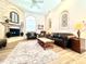Living room with fireplace, hardwood floors and large windows at 168 Rue Des Chateaux, Tarpon Springs, FL 34688