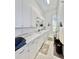 Bright laundry room with washer, dryer, and cabinets at 168 Rue Des Chateaux, Tarpon Springs, FL 34688