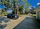 Spacious driveway with basketball court and ample parking at 168 Rue Des Chateaux, Tarpon Springs, FL 34688