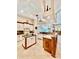 Open kitchen with large island and two-toned cabinets at 168 Rue Des Chateaux, Tarpon Springs, FL 34688
