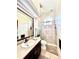 Bathroom with double vanity, shower, and toilet at 168 Rue Des Chateaux, Tarpon Springs, FL 34688