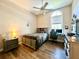 Bedroom with wood flooring and a workspace at 168 Rue Des Chateaux, Tarpon Springs, FL 34688