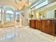 Large Primary bathroom with double vanity and soaking tub at 168 Rue Des Chateaux, Tarpon Springs, FL 34688