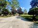 Expansive backyard with lush lawn and mature trees at 168 Rue Des Chateaux, Tarpon Springs, FL 34688