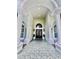 Impressive entryway with arched columns and double doors at 168 Rue Des Chateaux, Tarpon Springs, FL 34688