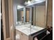 Bathroom with vanity, sink and large mirror at 11919 Royce Waterford Cir, Tampa, FL 33626