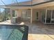 Spacious pool patio with outdoor kitchen at 11919 Royce Waterford Cir, Tampa, FL 33626