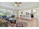 Open concept kitchen with island, stainless steel appliances, and white cabinets at 2709 17Th S St, St Petersburg, FL 33712