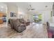 Living room with sliding doors leading to a patio at 1002 Pondview Ct, Tarpon Springs, FL 34689