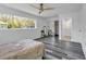 Main bedroom with a large window and ensuite bathroom at 12020 82Nd E St, Parrish, FL 34219