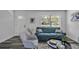 Bright and airy living room with gray sofa and modern decor at 12020 82Nd E St, Parrish, FL 34219